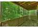 Back deck overlooking lush green trees at 6016 Gray Gate Ln # C, Charlotte, NC 28210