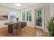 Charming dining area with wood floors, natural light, and access to the balcony at 6016 Gray Gate Ln # C, Charlotte, NC 28210