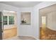 Kitchen features tile flooring, granite countertops, white cabinets, and stainless steel refrigerator at 6016 Gray Gate Ln # C, Charlotte, NC 28210