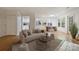 Inviting living room showcases wood floors, neutral tones, and seamless flow to dining and kitchen areas at 6016 Gray Gate Ln # C, Charlotte, NC 28210