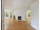 Bright living room with hardwood floors, a fireplace and a view of the green outdoors at 6016 Gray Gate Ln # C, Charlotte, NC 28210