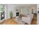 Bright living room with fireplace, wood floors, and neutral decor for a cozy, inviting space at 6016 Gray Gate Ln # C, Charlotte, NC 28210
