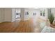 Bright living room featuring wood floors, large windows, and modern design at 6016 Gray Gate Ln # C, Charlotte, NC 28210