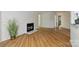 Bright, open living space featuring wood flooring and a charming fireplace at 6016 Gray Gate Ln # C, Charlotte, NC 28210