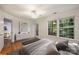 Spacious main bedroom with ensuite access, and plenty of natural light from surrounding trees at 6016 Gray Gate Ln # C, Charlotte, NC 28210