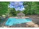 Inviting community pool with lounge chairs, perfect for summertime relaxation at 6016 Gray Gate Ln # C, Charlotte, NC 28210