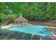 Inviting community pool with lounge chairs, perfect for summertime relaxation at 6016 Gray Gate Ln # C, Charlotte, NC 28210