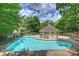 Inviting community pool with lounge chairs, perfect for summertime relaxation at 6016 Gray Gate Ln # C, Charlotte, NC 28210