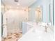 Bathroom with double sinks, tiled floors, and a large glass enclosed shower stall at 6202 Pumpernickel Ln, Wesley Chapel, NC 28110