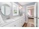 Bathroom featuring granite countertops, double sinks, and natural light at 6202 Pumpernickel Ln, Wesley Chapel, NC 28110