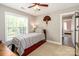 Cozy bedroom with natural light from the window and neutral paint at 6202 Pumpernickel Ln, Wesley Chapel, NC 28110