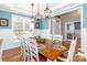 Open dining room with hardwood floors, wainscoting, and natural light at 6202 Pumpernickel Ln, Wesley Chapel, NC 28110