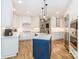 Bright kitchen featuring stainless steel appliances, ample counter space, and a large island with a blue base at 6202 Pumpernickel Ln, Wesley Chapel, NC 28110