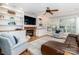 Living room with built-ins, fireplace, and large windows for natural light at 6202 Pumpernickel Ln, Wesley Chapel, NC 28110
