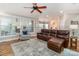 Inviting living room with hardwood floors and large windows provides ample natural light and a great living space at 6202 Pumpernickel Ln, Wesley Chapel, NC 28110