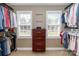 Well-organized walk-in closet with custom shelving and drawers for ample storage at 6202 Pumpernickel Ln, Wesley Chapel, NC 28110