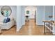 Inviting hallway with hardwood floors leading to an open-concept kitchen at 6208 Rocky Falls Rd, Charlotte, NC 28211
