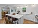 Stylish kitchen featuring custom cabinets, stainless steel appliances, and island seating at 6208 Rocky Falls Rd, Charlotte, NC 28211