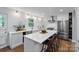 Modern kitchen with stainless steel appliances, a large island, and custom cabinetry at 6208 Rocky Falls Rd, Charlotte, NC 28211