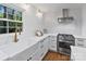 Modern kitchen with a stainless steel range, farmhouse sink, and ample counter space at 6208 Rocky Falls Rd, Charlotte, NC 28211