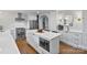 Bright kitchen with a stainless steel refrigerator, modern microwave, and sleek island at 6208 Rocky Falls Rd, Charlotte, NC 28211