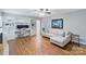 Comfortable living room area with built-in desk area and shelving, providing a functional and inviting space at 6208 Rocky Falls Rd, Charlotte, NC 28211