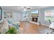 Cozy living room featuring a brick fireplace, built-in shelving, and a comfortable sofa with accent pillows at 6208 Rocky Falls Rd, Charlotte, NC 28211