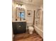 Stylish bathroom with a modern vanity, a framed mirror and a shower-tub combination at 7228 Rollingridge Dr, Charlotte, NC 28211
