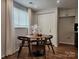 Cozy dining area with seating for four and natural light, creating an intimate space for casual meals at 7228 Rollingridge Dr, Charlotte, NC 28211