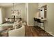Elegant dining area with modern chandelier, dining table set, and comfortable seating next to bar seating at 7228 Rollingridge Dr, Charlotte, NC 28211