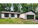Charming single-story home with a well-manicured lawn and a two-car garage at 7228 Rollingridge Dr, Charlotte, NC 28211