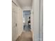 Hallway with neutral carpet, light walls, a door to the bedroom, and closet at 7228 Rollingridge Dr, Charlotte, NC 28211