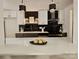 Modern kitchen boasts sleek black marble backsplash, white cabinets, and a bright white quartz countertop island at 7228 Rollingridge Dr, Charlotte, NC 28211