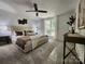 Spacious main bedroom with a ceiling fan, natural light, and decorative accents at 7228 Rollingridge Dr, Charlotte, NC 28211