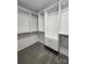 Walk-in closet with white shelves and built in storage at 7228 Rollingridge Dr, Charlotte, NC 28211