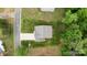 Aerial view of a home showing its driveway and surrounding greenery, with a clear view of the roof and yard at 7308 Rothmore St, Charlotte, NC 28215