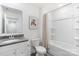 Clean bathroom with granite counters, a bathtub-shower combo and bright lighting creating a welcoming and functional space at 7308 Rothmore St, Charlotte, NC 28215
