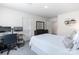 Bright bedroom with sleek desk setup, creating a comfortable and functional workspace complemented by ample natural light at 7308 Rothmore St, Charlotte, NC 28215