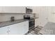 Stylish kitchen showcasing sleek appliances, granite countertops, and modern cabinetry at 7308 Rothmore St, Charlotte, NC 28215