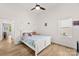 This bright bedroom has hard wood floors, one window, and is decorated with a small rainbow on the wall at 7683 Sarah Dr, Denver, NC 28037