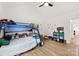 This is a playful bedroom with a bunk bed, natural light, and ample space for fun activities at 7683 Sarah Dr, Denver, NC 28037