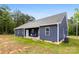 Charming home featuring a covered porch, blue siding, and a well-maintained yard at 7683 Sarah Dr, Denver, NC 28037
