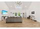 Spacious living room with high ceilings, wood floors, and lots of natural light creates an inviting atmosphere at 7683 Sarah Dr, Denver, NC 28037