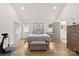 Spacious main bedroom featuring an en-suite bathroom and a walk-in closet, offering comfort and convenience at 7683 Sarah Dr, Denver, NC 28037