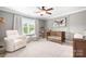 Charming bedroom featuring neutral colors, a crib, and large windows at 7738 Burning Ridge Dr, Stanley, NC 28164