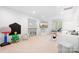 Spacious bonus room with TV, toys and a comfortable seating area at 7738 Burning Ridge Dr, Stanley, NC 28164