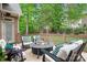 Relaxing outdoor deck with a fire pit and ample seating at 7738 Burning Ridge Dr, Stanley, NC 28164