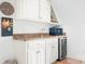 Charming wet bar with granite countertops and a mini fridge at 7738 Burning Ridge Dr, Stanley, NC 28164