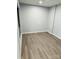 Neutral bedroom featuring modern wood-look floors and freshly painted walls at 8029 Cedar Glen Dr, Charlotte, NC 28212