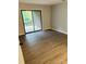 Cozy bedroom with sliding glass doors and wood-look flooring at 8029 Cedar Glen Dr, Charlotte, NC 28212
